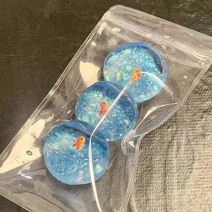 Ocean Planet Squishy Fidget Toy Soft Cute Little goldfish Pinch Decompression Toy Planet Sequin Anti-Anxiety toy for Kids Gifts